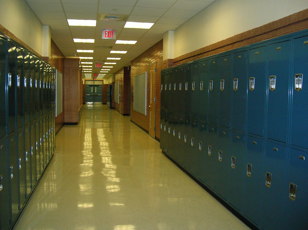 An empty school hallway lined with lockers
